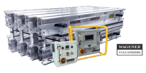 Industrial vulcanizer system with stacked aluminum frames and a yellow safety frame around the control panel (WAGENER VULCANIZERS).