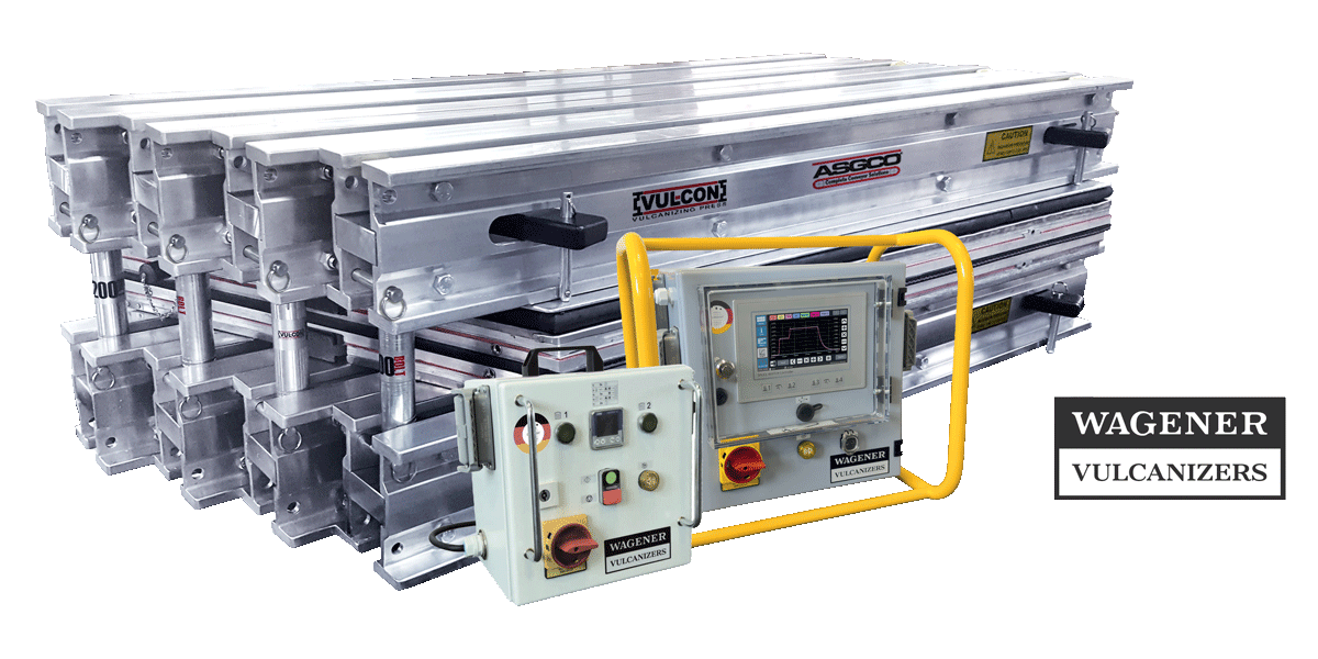 Industrial vulcanizer system with stacked aluminum frames and a yellow safety frame around the control panel (WAGENER VULCANIZERS).